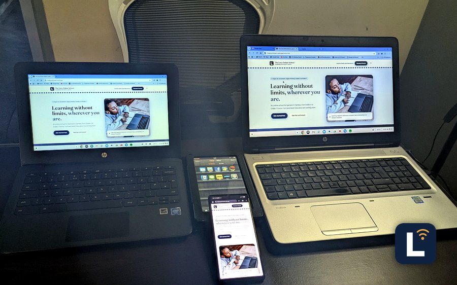 The Lory Online School site shown on laptops, a tablet, and a phone