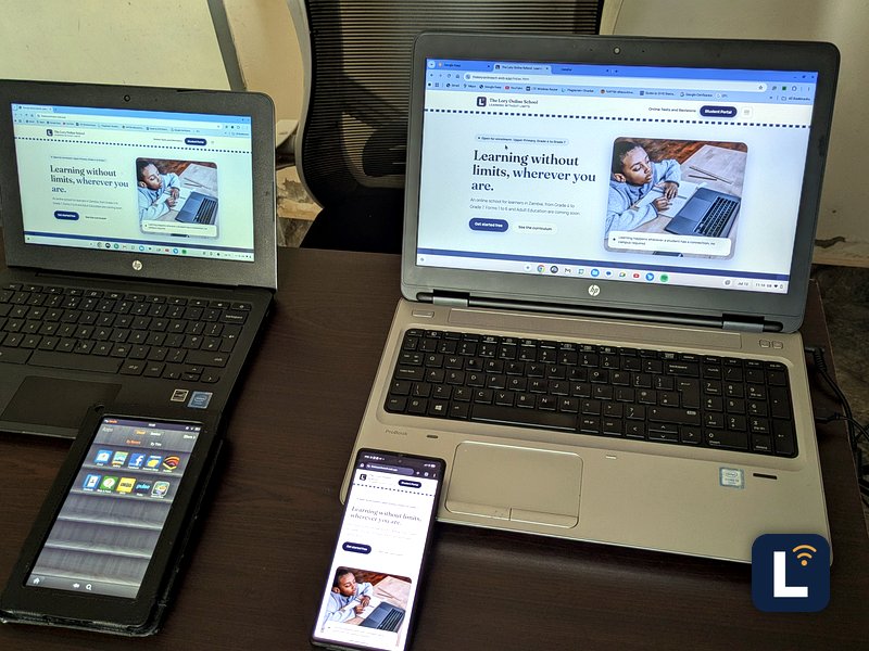 The Lory Online School site shown on laptops, a tablet, and a phone