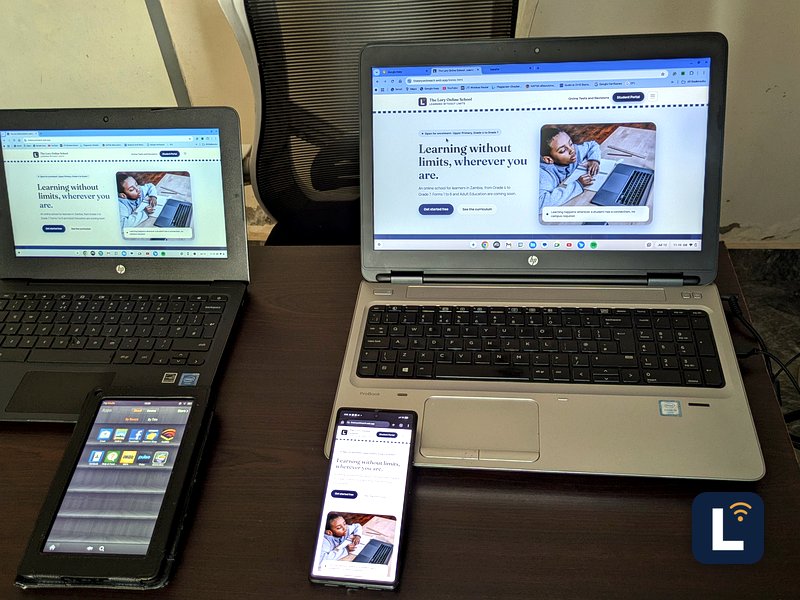 The Lory Online School site shown on laptops, a tablet, and a phone